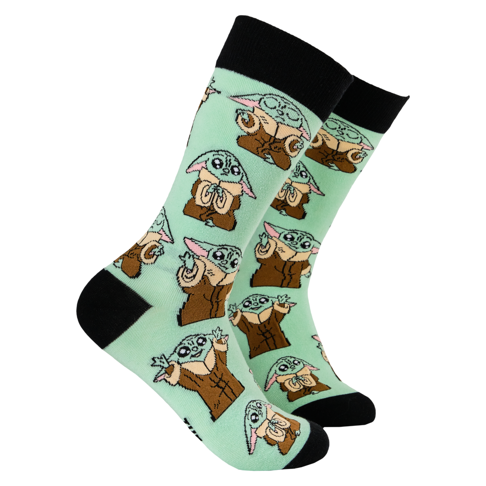 
                      
                        Star Wars Socks - Grogu. A pair of socks depicting Grogu from Star Wars. Green legs, black toe, heel and cuff. 
                      
                    