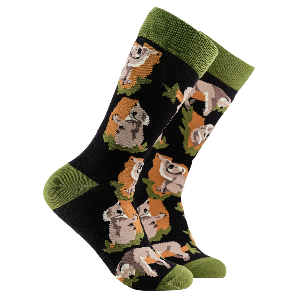 
                      
                        Koala Socks - G'Night Mate. A pair of socks depicting koala bears. Black legs, green cuff, heel and toe.
                      
                    