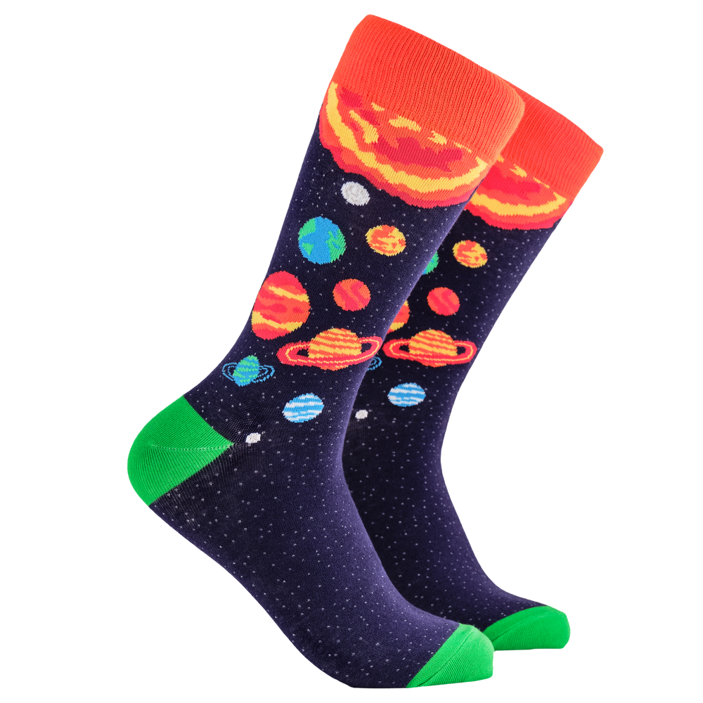 Galaxy Socks. A pair of socks depicting planets and stars. Purple legs, orange cuff, green heel and toe.