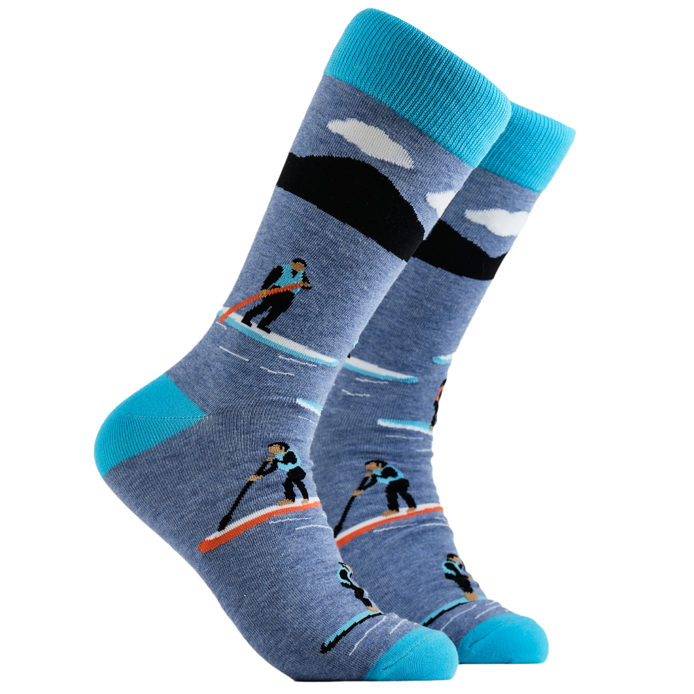 Paddle Board Socks - Get Paddling. A pair of socks depicting paddle boarding. Blue legs, bright blue cuff, heel and toe.