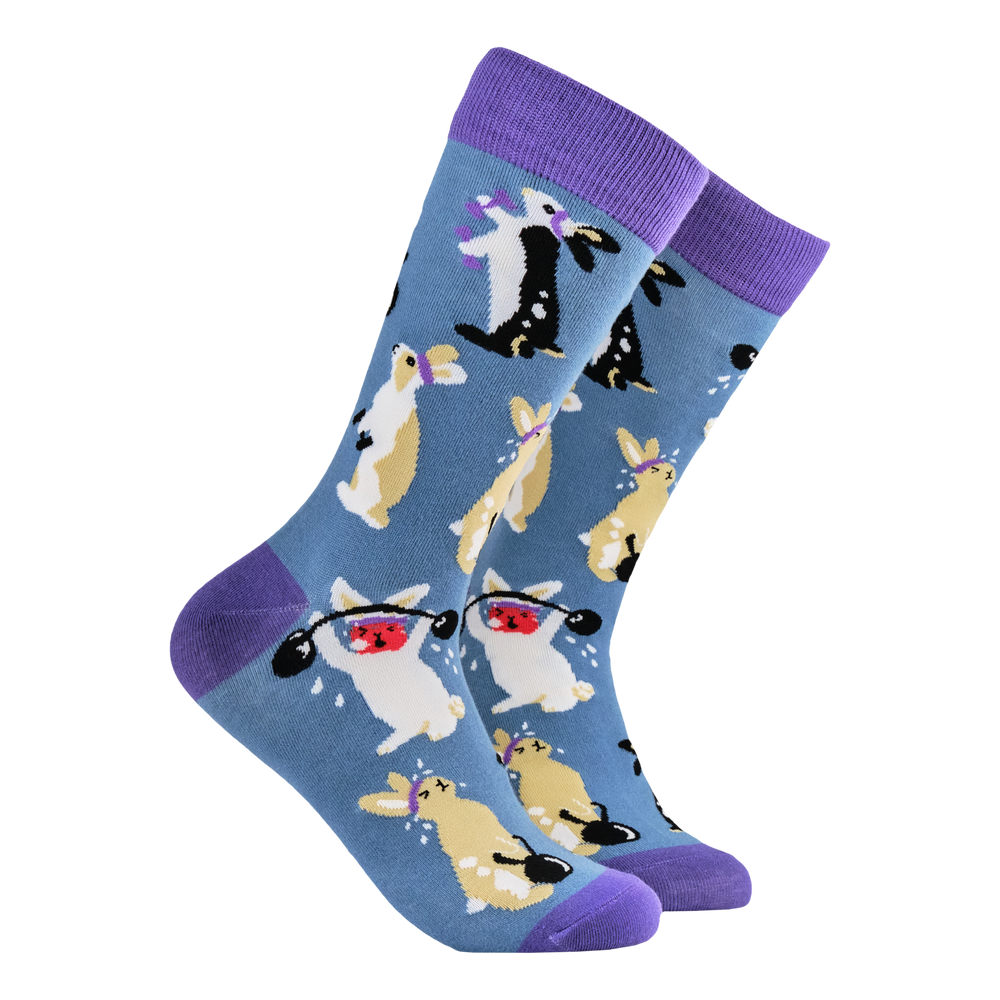 Rabbit Socks - Gym Bunny. A pair of socks depicting rabbits lifting weights. Blue legs, purple cuff, toe and heel. 