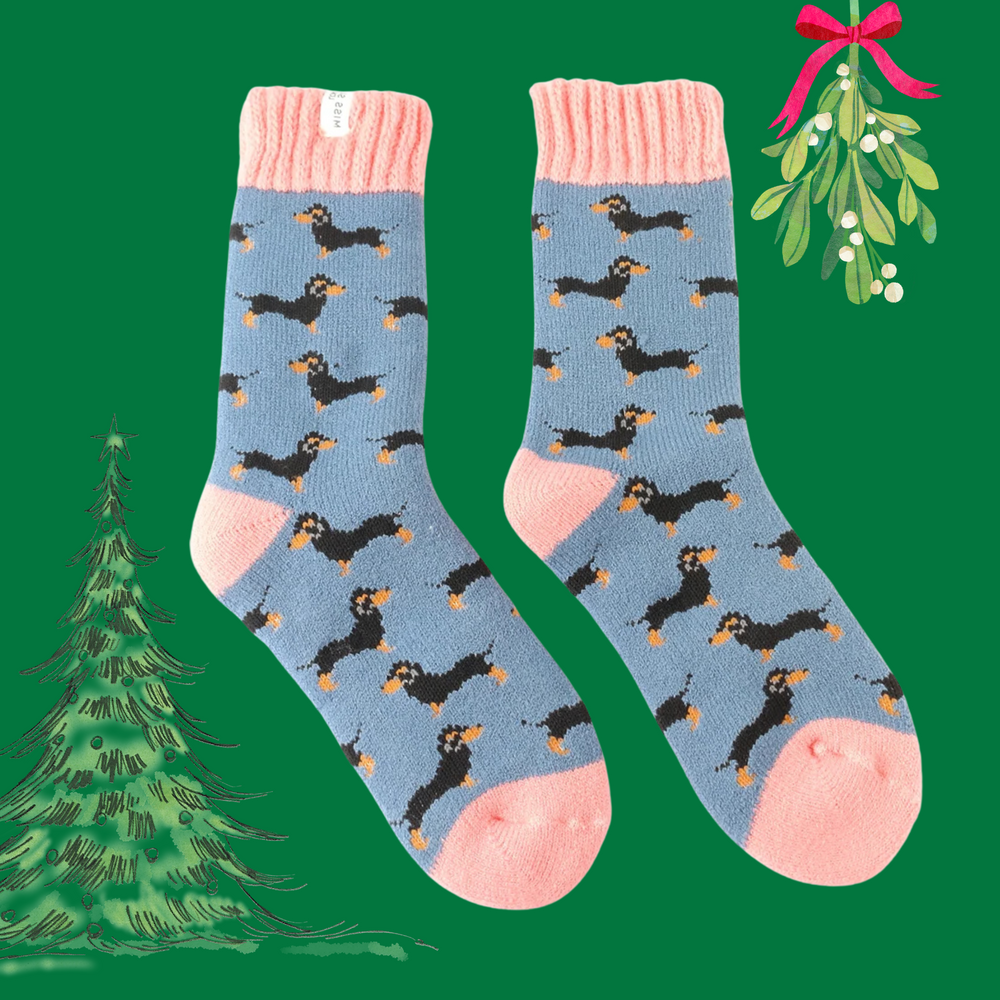 
                      
                        A pair of winter socks depicting sausage dogs. Pink toe, heel and cuff. 
                      
                    