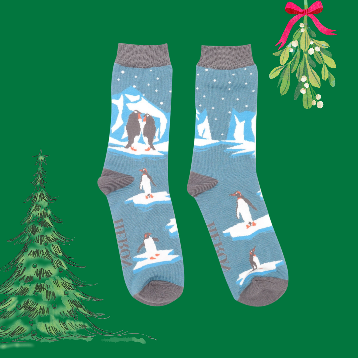 A pair of socks depicting penguins on ice. Blue legs. Grey toes, heel and cuff. 