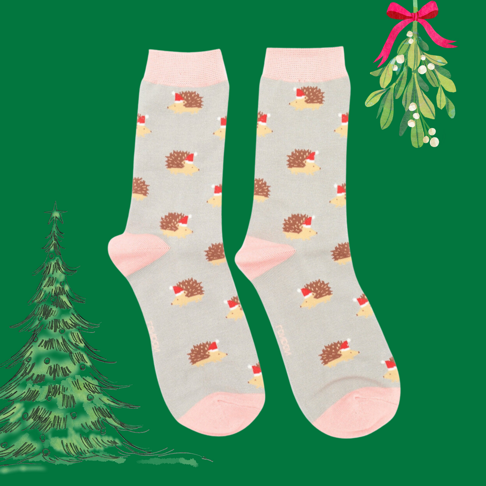 
                      
                        A pair of socks depicting a festive hedgehog pattern. Grey legs, pink heel, toe and cuff. 
                      
                    