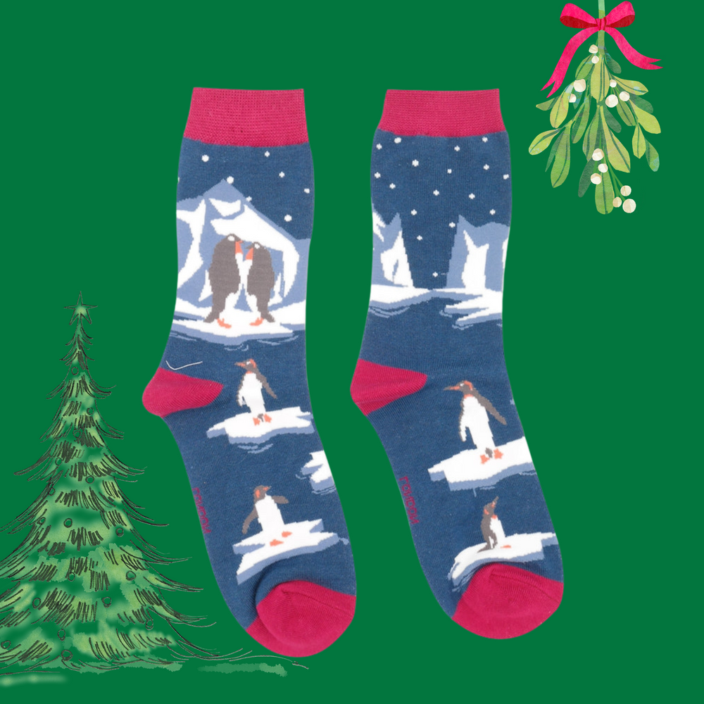 
                      
                        A pair of socks depicting penguins on ice. Blue legs. Red toes, heel and cuff. 
                      
                    