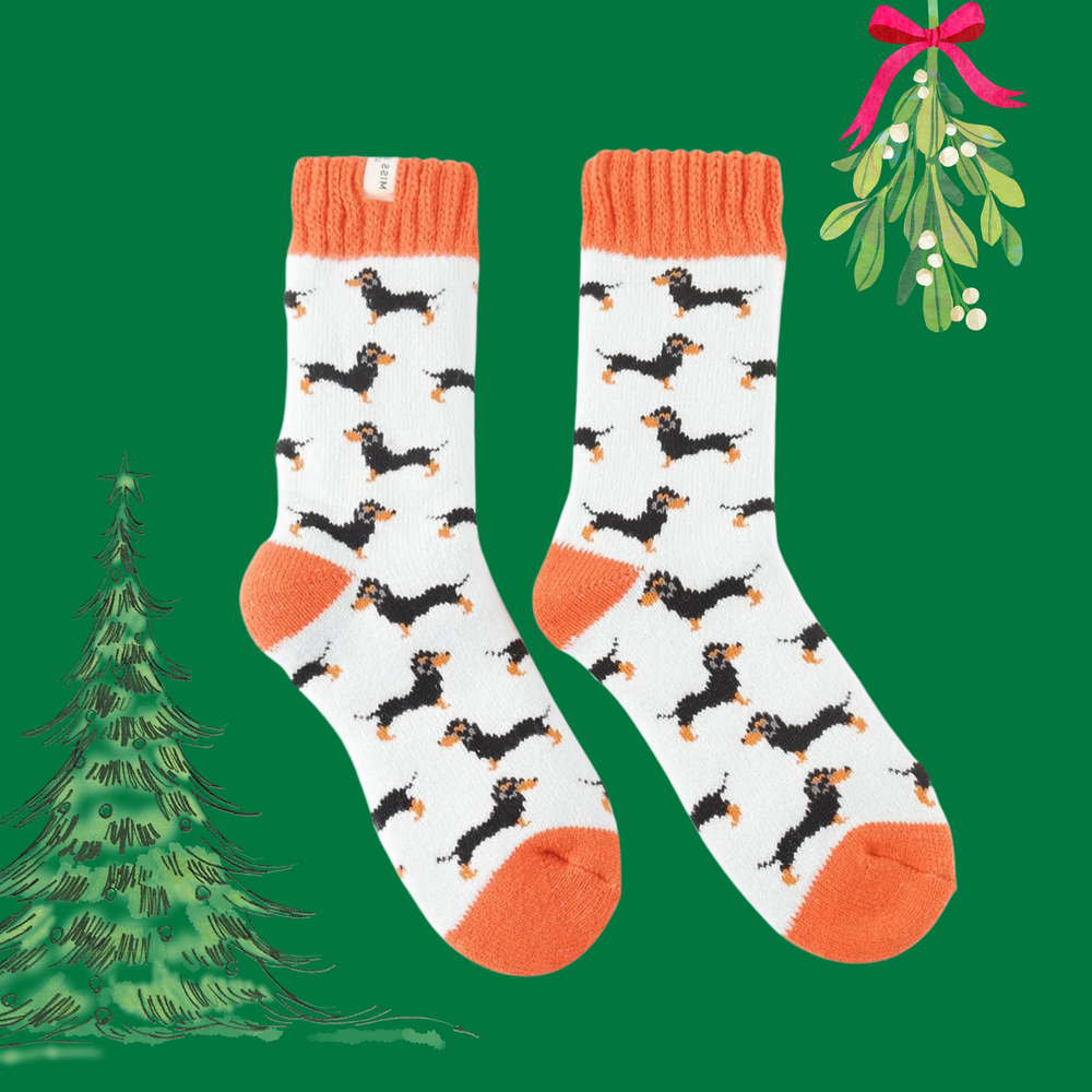 A pair of winter socks depicting sausage dogs.Orange toe, heel and cuff. 