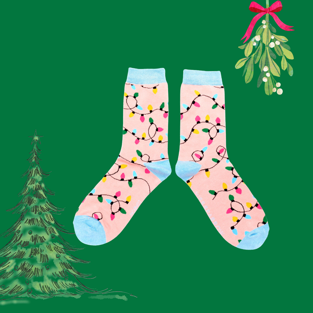 
                      
                        A pair of socks with a christmas light motif. Pink legs, blue heel, toe and cuff. 
                      
                    