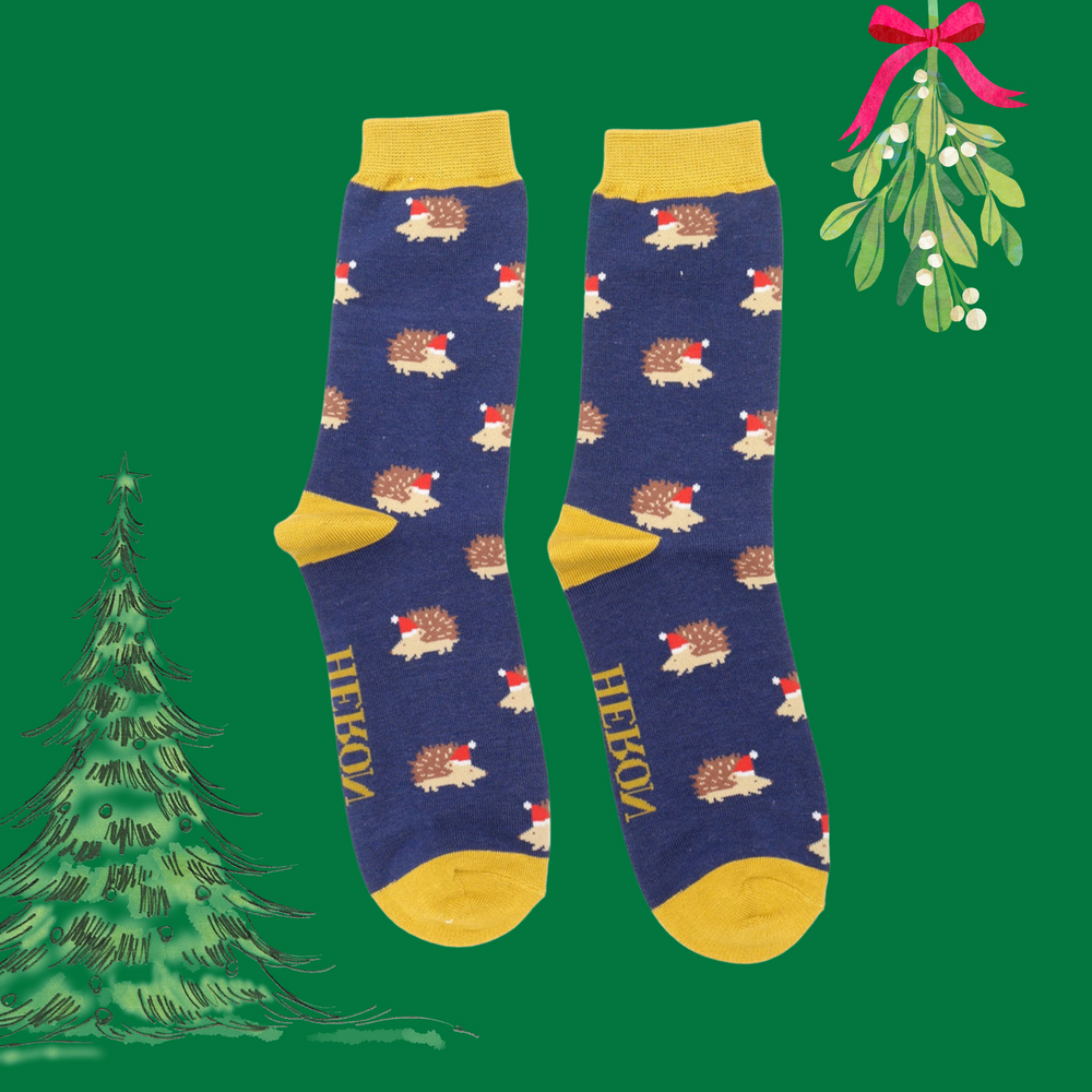 
                      
                        A pair of socks depicting a festive hedgehog pattern. Dark blue legs, yellow heel, toe and cuff. 
                      
                    