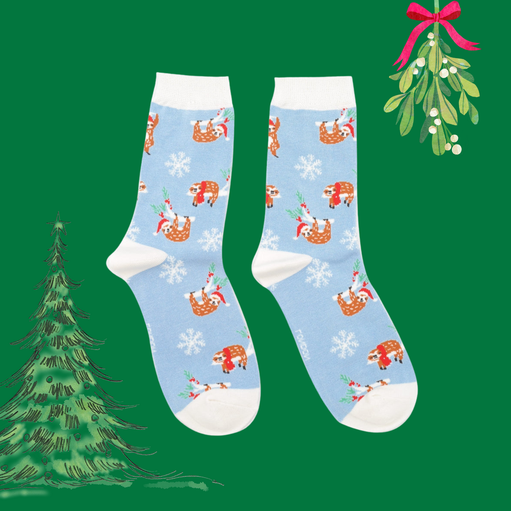 
                      
                        A pair of socks depicting xmas sloths wearing santa hats. Blue legs, white heel, toe and cuff. 
                      
                    