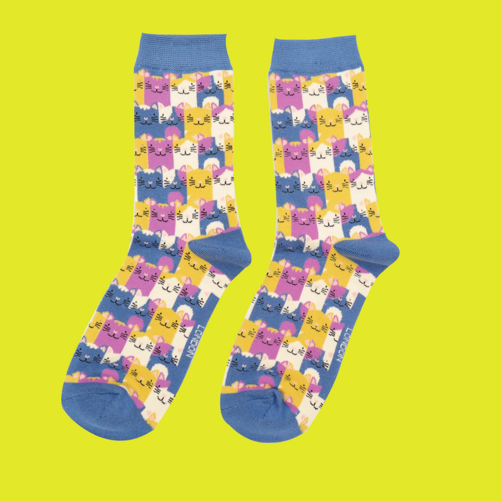 
                  
                    A pair of socks with a multicoloured happy anime cat pattern. Blue heel, toe and cuff.
                  
                