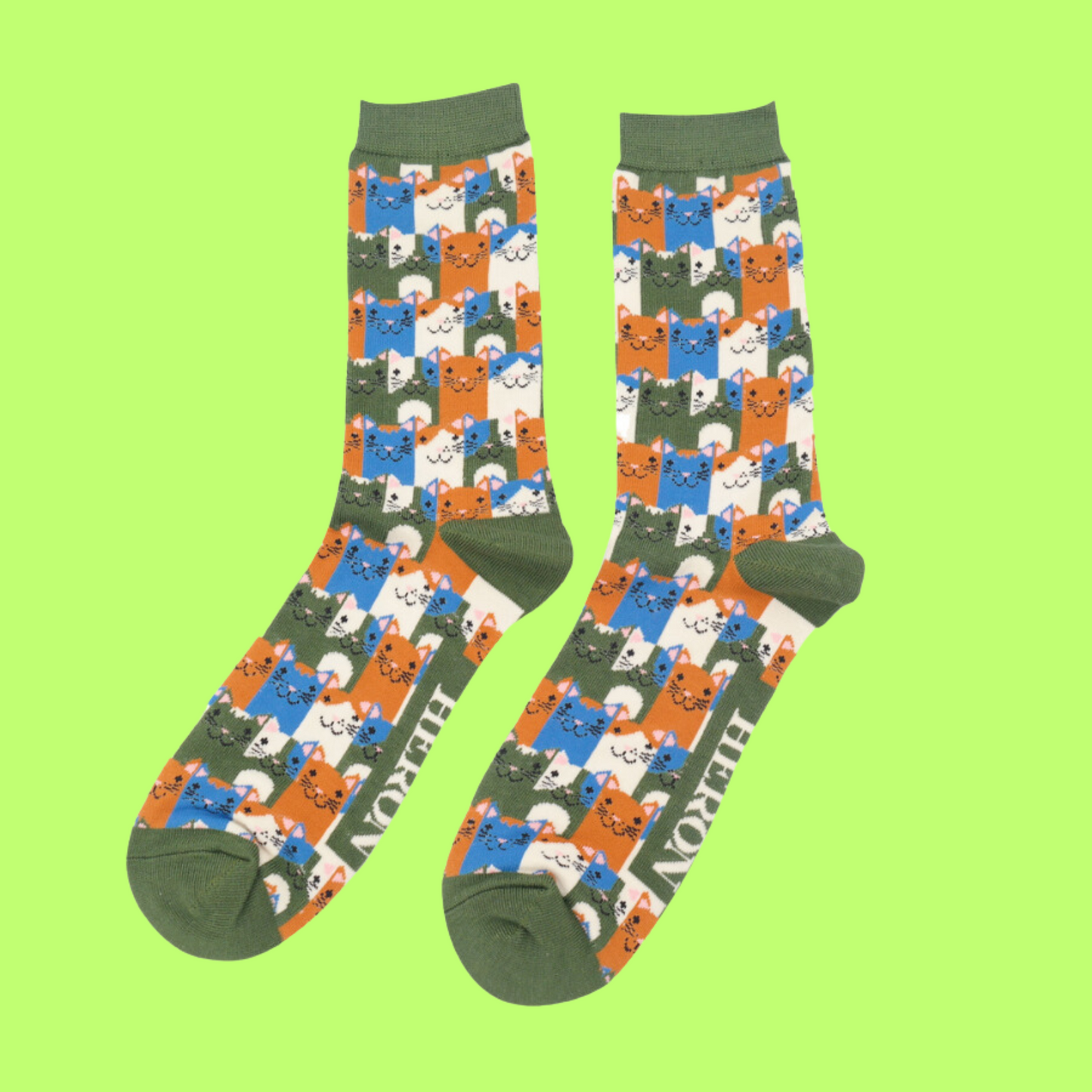 
                  
                    A pair of socks with a multicoloured happy anime cat pattern. Green heel, toe and cuff.
                  
                