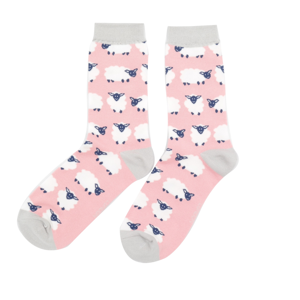 
                  
                    Happy Sheep Bamboo Socks - Miss Sparrow. A pair of socks depicting happy sheep. Pink legs, grey heel, toe and cuff. 
                  
                