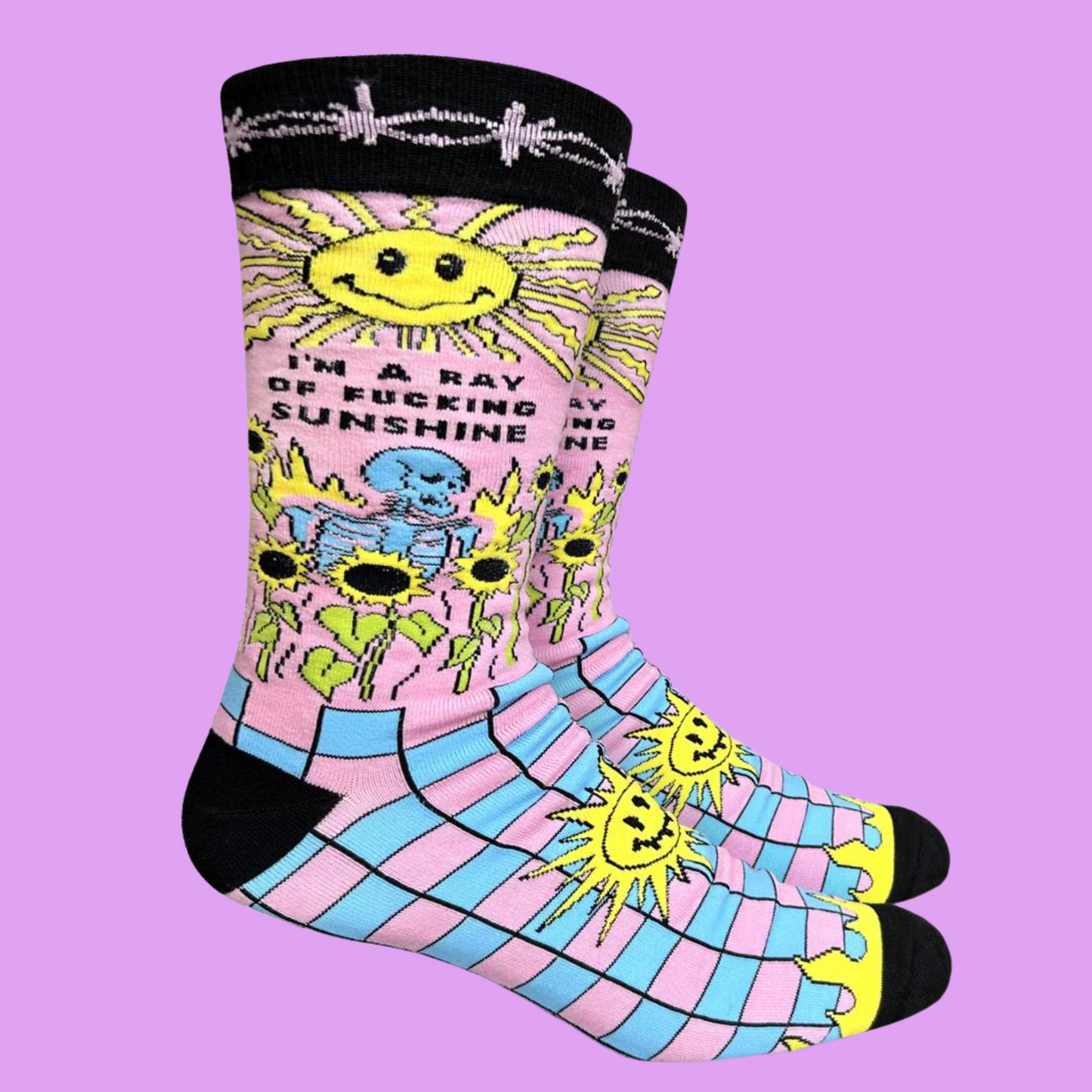 
                  
                    A pair of socks with a psychedelic sun shine pattern in bright blue and pink. Black toes, heel and cuff.
                  
                