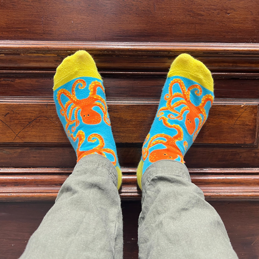 Jamie wearing a pair of Captain Soctopus socks. 