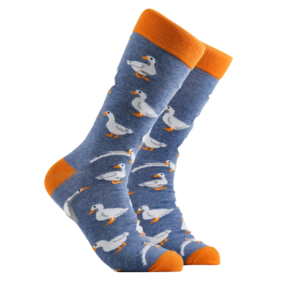 Duck Socks - I Am Not a Goose. A pair of socks depicting white ducks. Blue legs, orange cuff, heel and toe.