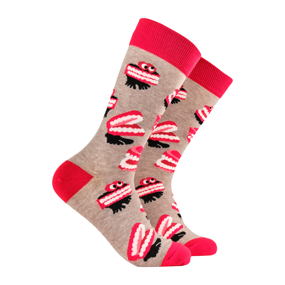 
                      
                        Denture Socks - It's a Laugh. A pair of socks featuring wind up teeth. Brown legs, red heel, toe and cuff. 
                      
                    