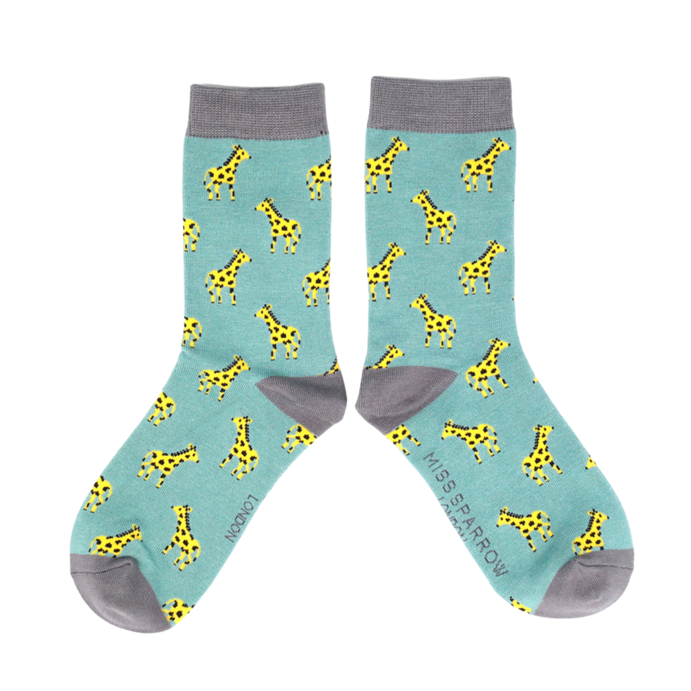 Little Giraffes Bamboo Socks - Miss Sparrow. A pair of socks depicting giraffes. Teal legs, grey cuffs, toes, and heels.  