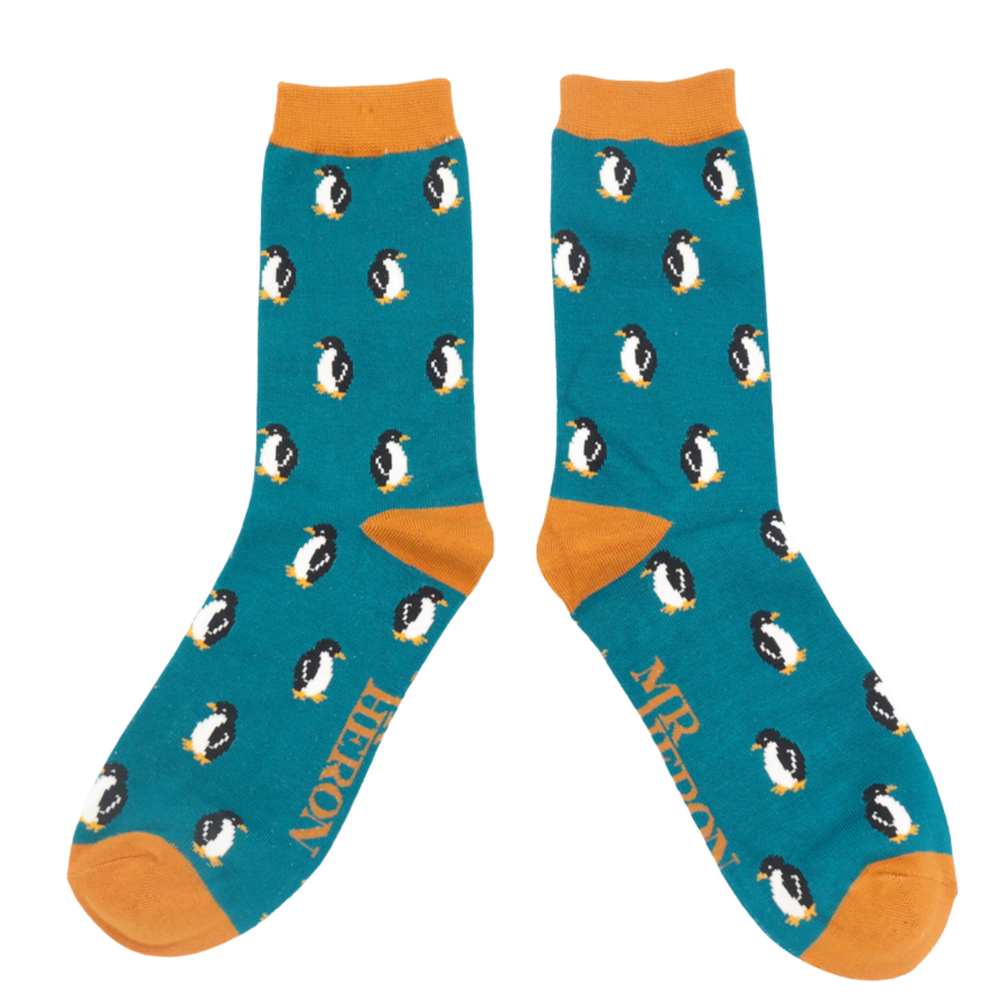 
                  
                    A pair of socks with a penguin pattern. Teal legs, orange heel, cuff and toe.
                  
                