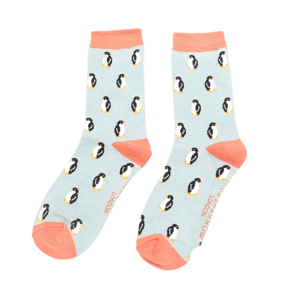 
                  
                    A pair of socks with a penguin pattern. Light blue legs, peach heel, cuff and toe.
                  
                