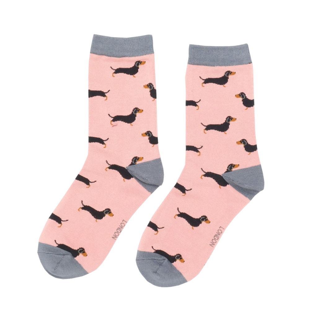 
                  
                    A pair of socks featuring a sausage dog pattern. Pink legs, grey cuffs, heel and toe.
                  
                