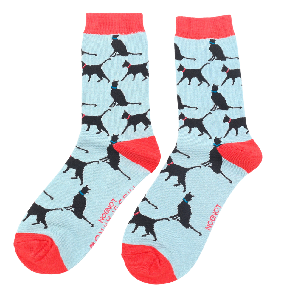 A pair of socks depicting lucky black cats. Light Blue legs, red heel, toe and cuff.