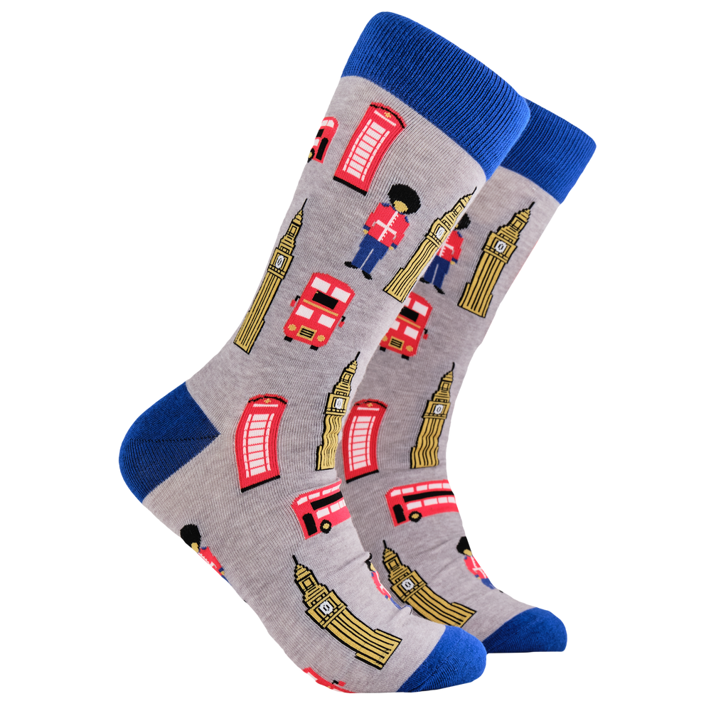 London Socks - Londonium. A pair of socks depicting London icons. Grey legs, blue cuff, heel and toe.