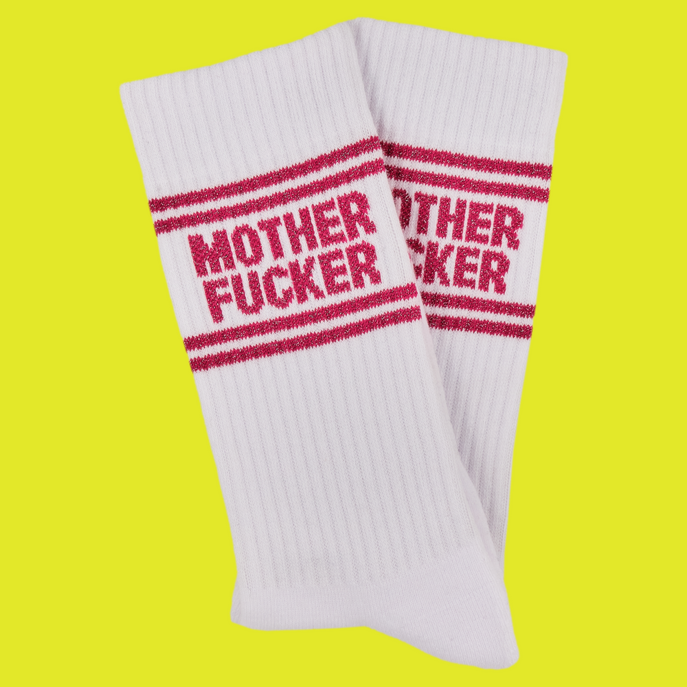 
                  
                    A white pair of athletic socks with red trim on the ankles and toes. With a very rude insult involving mothers on the ankle.
                  
                