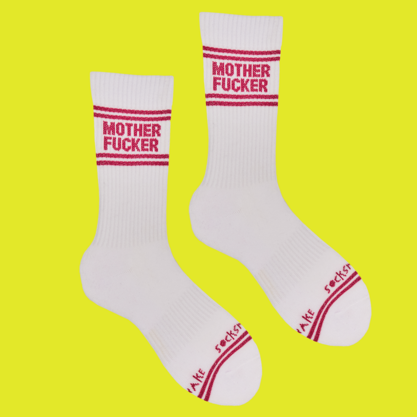 A white pair of athletic socks with red trim on the ankles and toes. With a very rude insult involving mothers on the ankle.