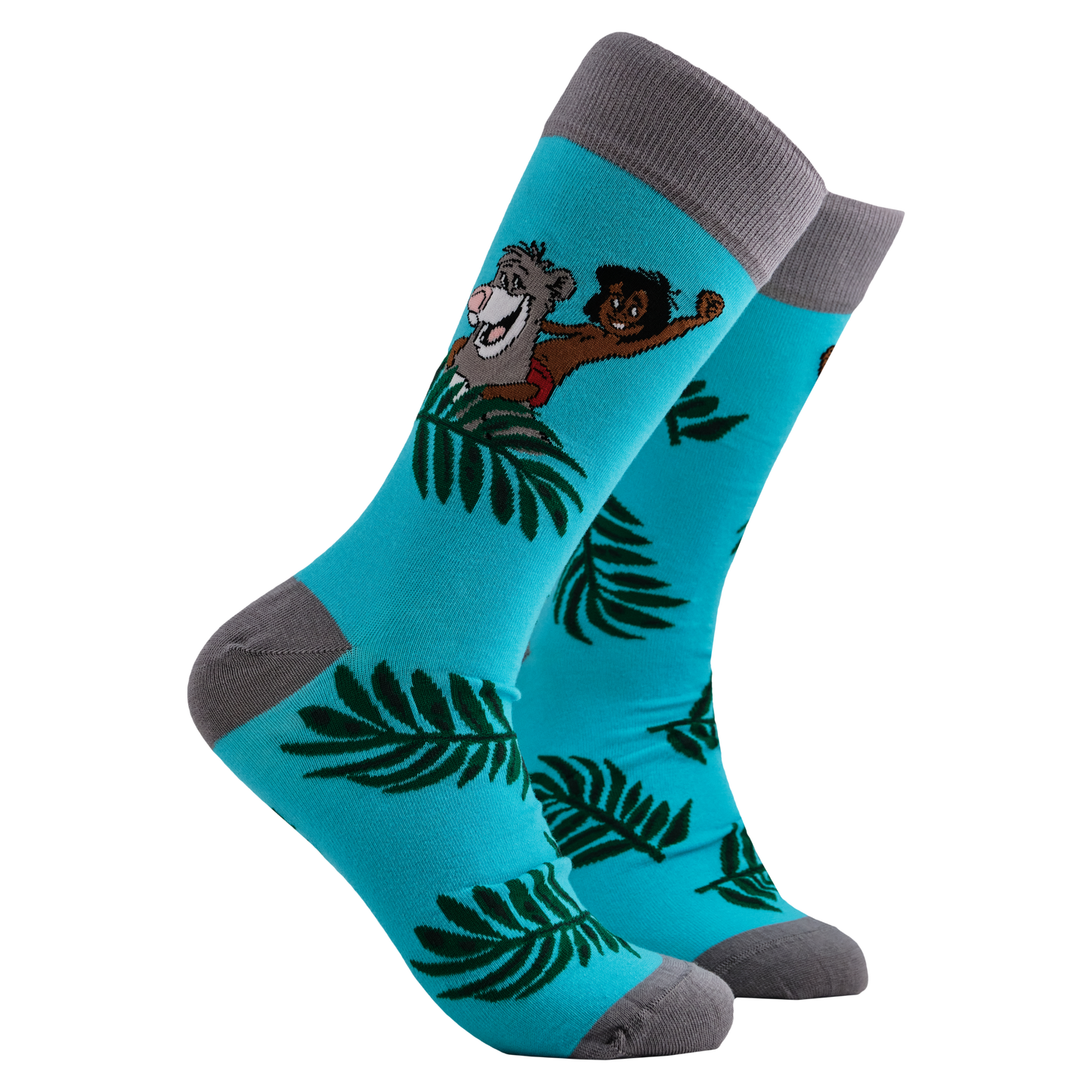 Disney's Jungle Book Socks - Mowgli and Baloo. A pair of socks depicting Mowglie and Baloo playing in the jungle. Turquoise legs, grey toes, heel and cuff. 