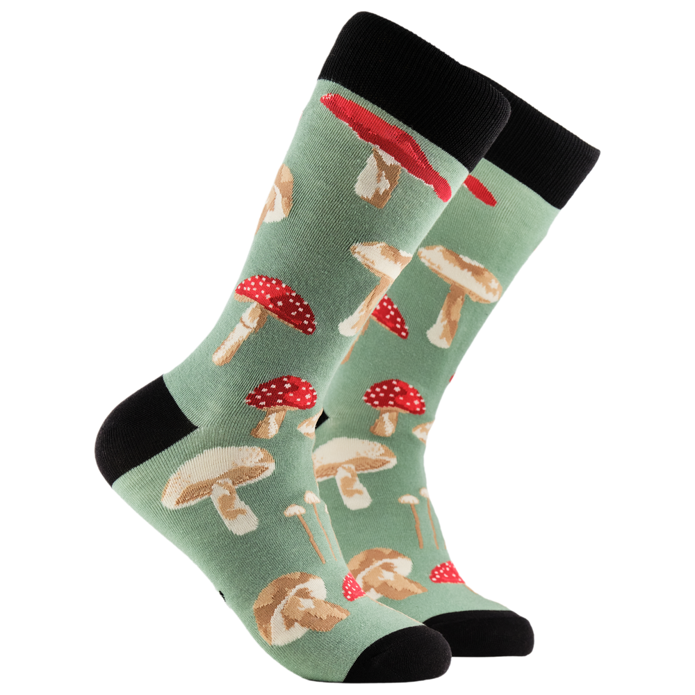 Mushrooms Bamboo Socks. A pair of socks depicting different species of mushroom. Green legs, black cuff, heel and toe.