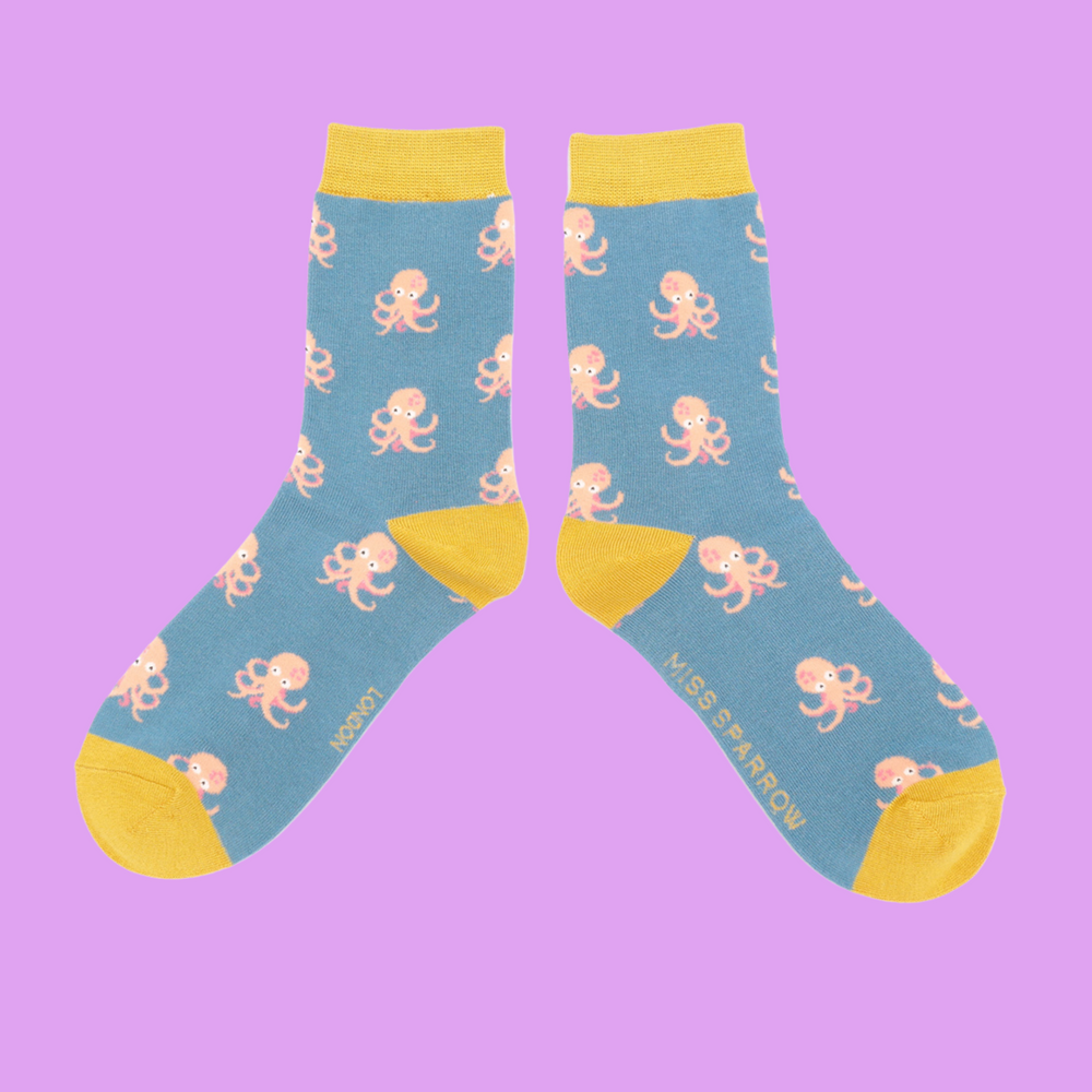 
                  
                    A pair of socks with an octopus pattern. Blue legs, yellow heel, toe and cuff.
                  
                