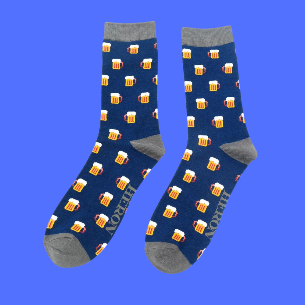 
                  
                    A pair of socks depicting pints of frothing beer. Royal blue legs, dark grey toe, cuff and heel.
                  
                