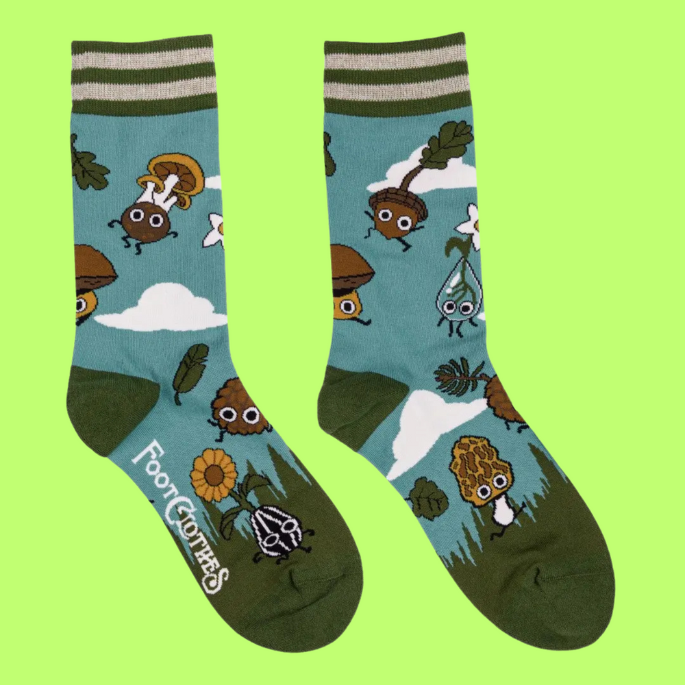 
                      
                         A pair of socks depicting cute woodland creatures. Bright blue legs, green heel, toe and cuff. 
                      
                    