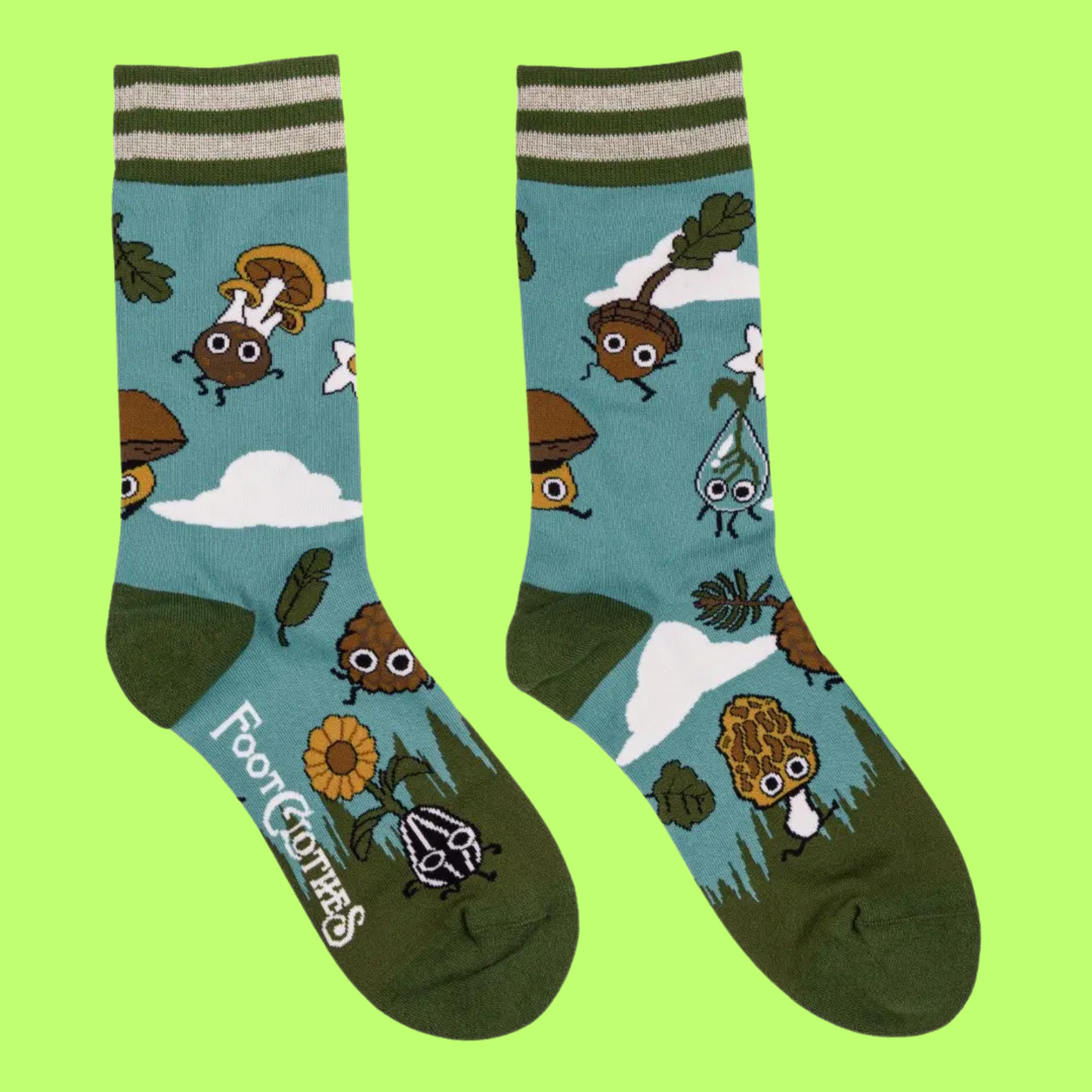  A pair of socks depicting cute woodland creatures. Bright blue legs, green heel, toe and cuff. 