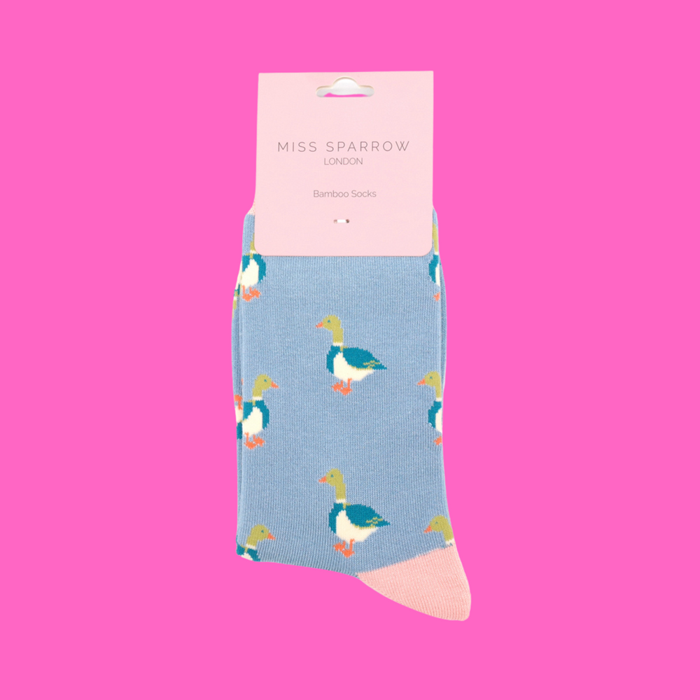 
                  
                    A pair of socks with a pattern of ducks. Light blue legs, pink cuff, toe and heel.
                  
                