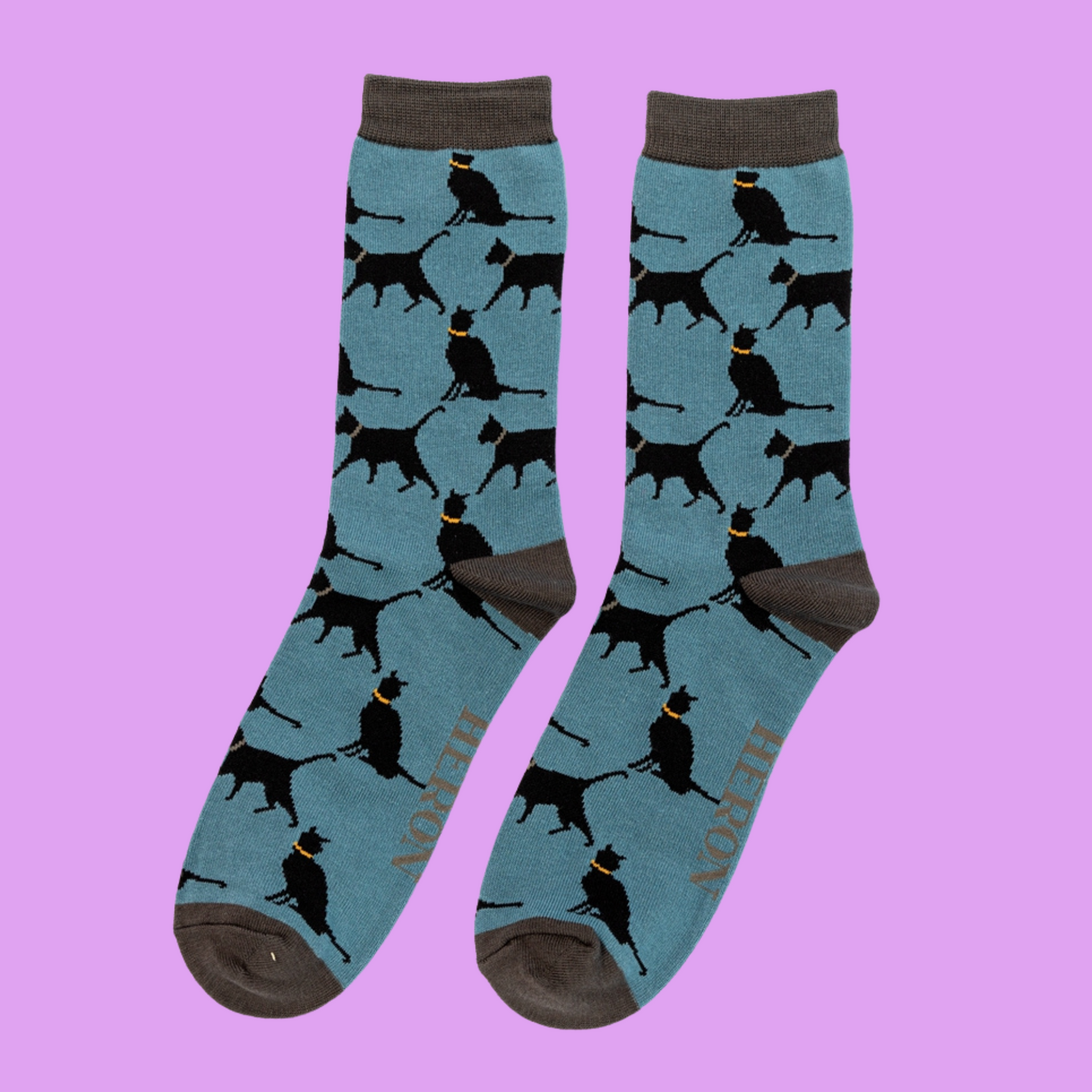 
                  
                    Lucky Cats Bamboo Socks - Miss Sparrow. A pair of socks depicting lucky black cats. Blue legs, grey heel, toe and cuff. 
                  
                