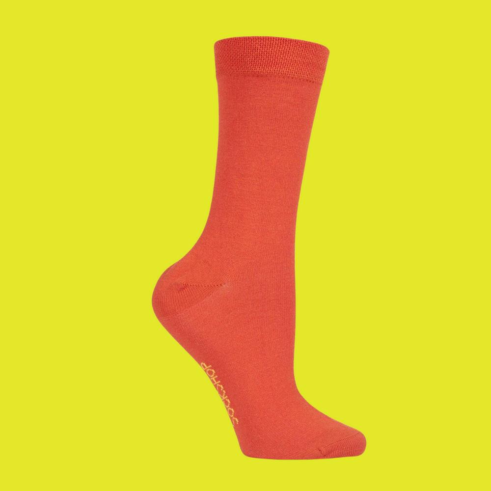 A pair of orange bamboo socks. 