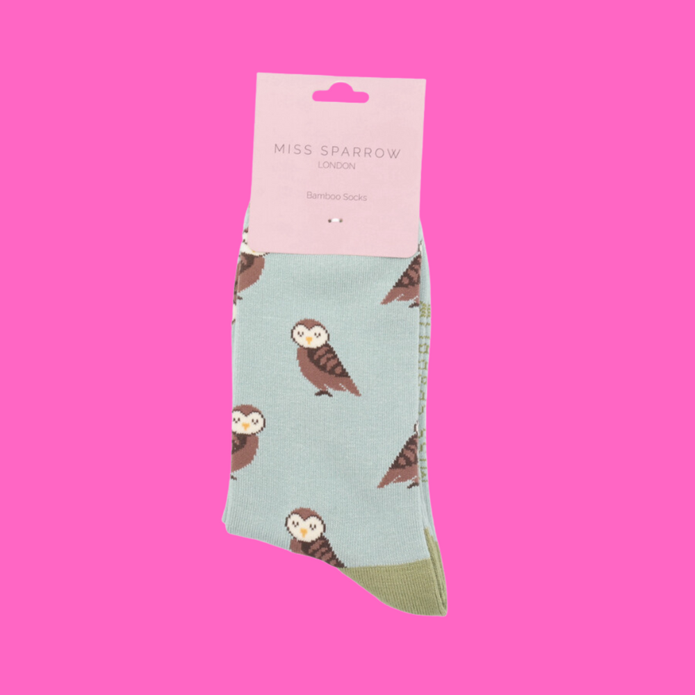 
                  
                    A pair of socks depicting cute owls. Blue legs, green cuff, toe and heel.
                  
                