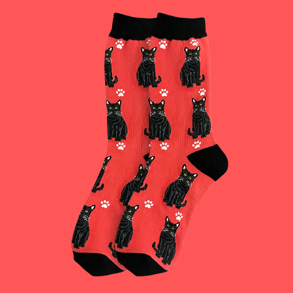 
                  
                    A pair of socks featuring black cats. Red legs, black heel, toe and cuff.
                  
                