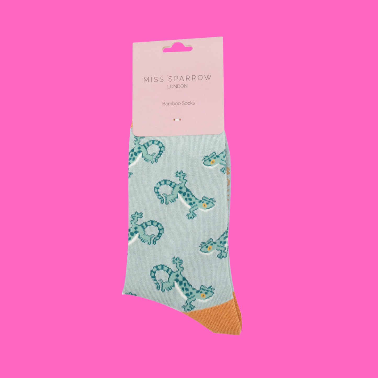 
                  
                    A pair of socks with a lizard pattern. Turquoise legs, orange heel, cuff and toe.
                  
                