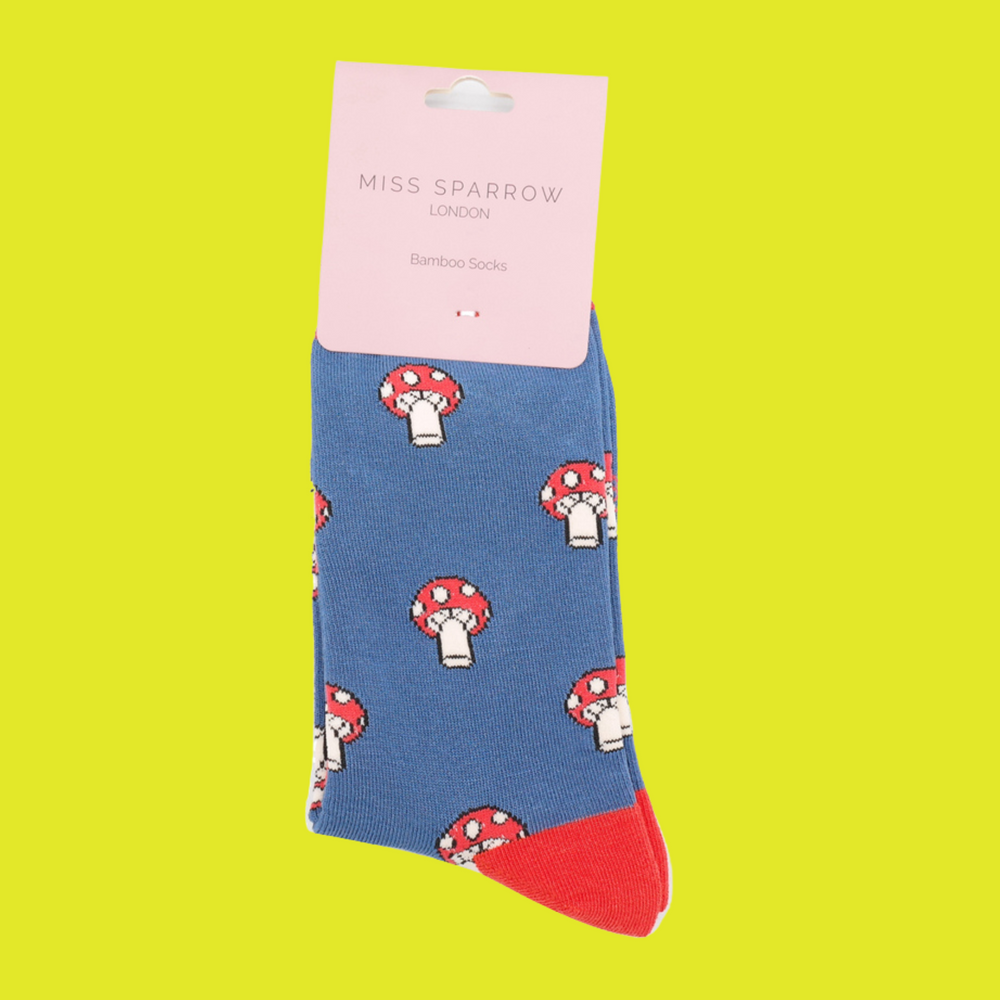 
                      
                        A pair of socks with a mushroom pattern. Blue legs, red cuff, heel and toe.
                      
                    