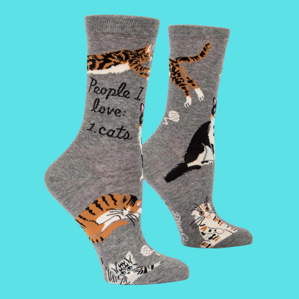 
                      
                        A pair of socks featuring playful cats. Grey legs, heel, toe and cuff. 
                      
                    