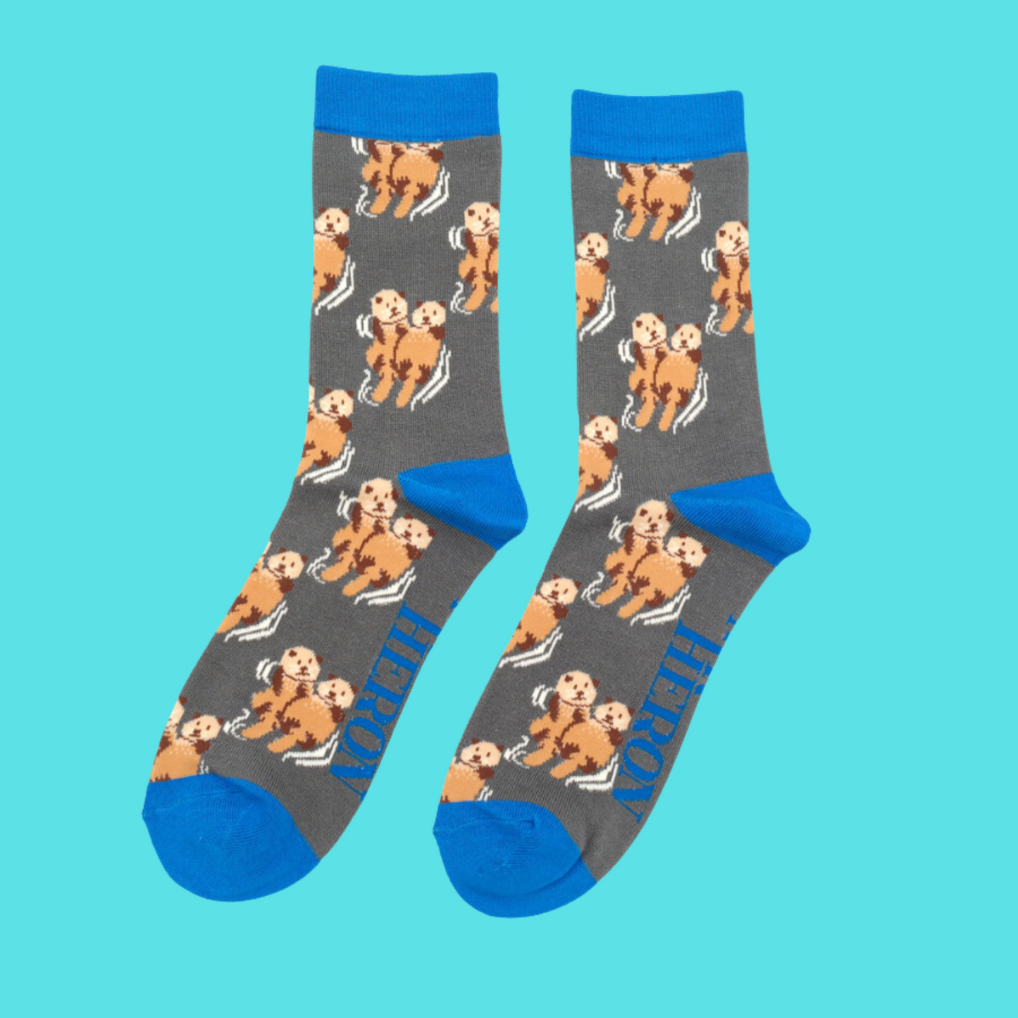 
                  
                    A pair of socks depicting otters holding hands. Grey legs, blue heel, toe and cuff.
                  
                