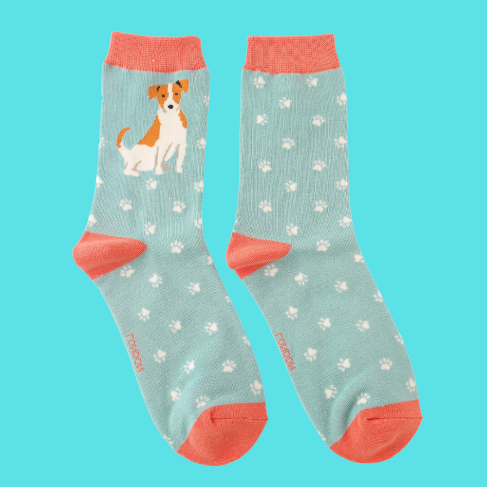 
                      
                        A pair of socks featuring a cute jack russell. Light blue legs, peach heel, toe and cuff. 
                      
                    