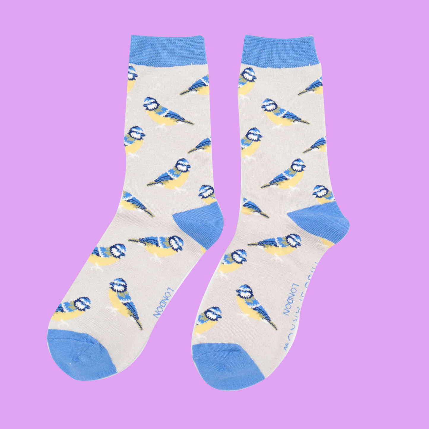 
                  
                    A pair of socks depicting Bluetits. Light grey legs, blue toe, cuff and heel.
                  
                