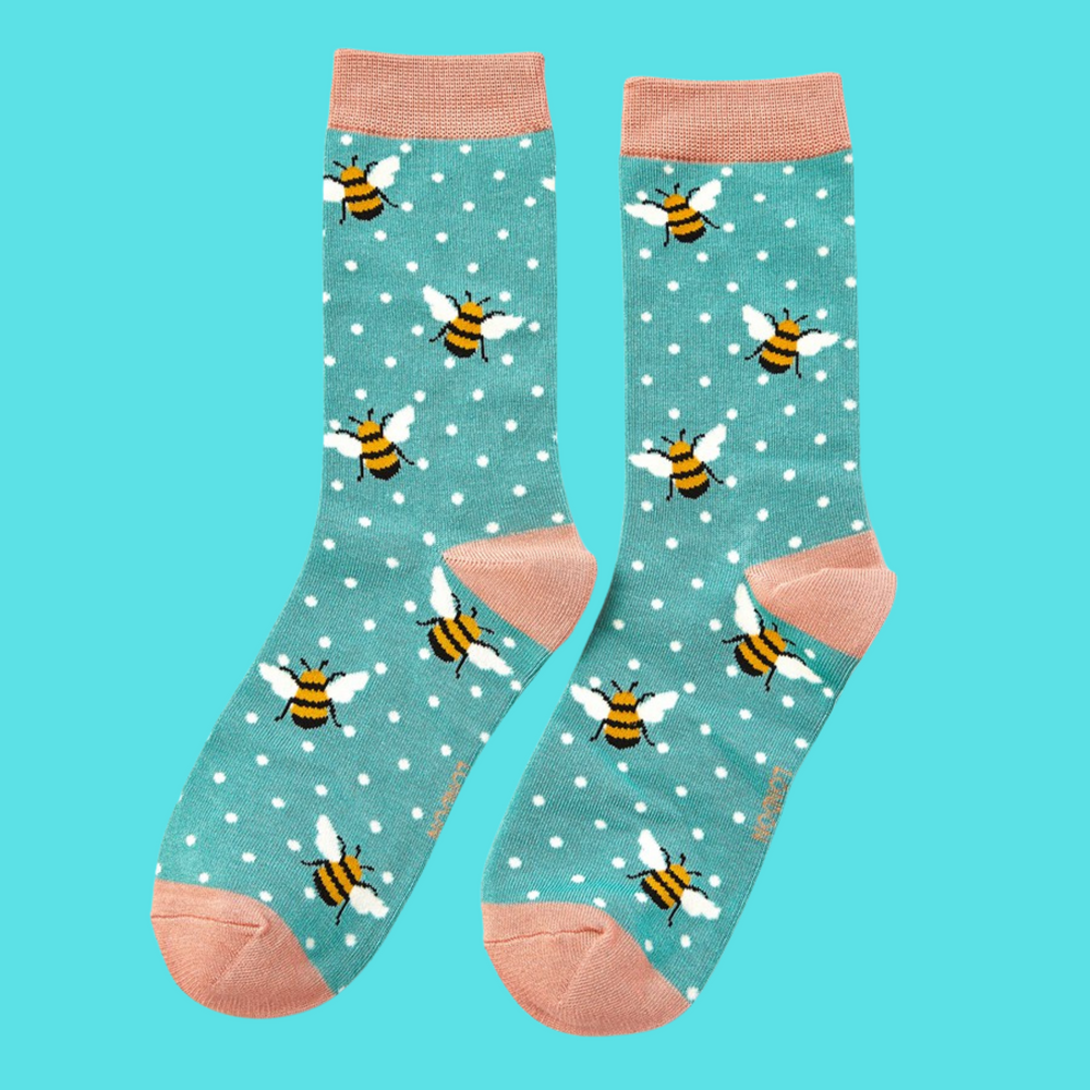 
                      
                        A pair of socks depicting bumble bees. Light blue legs, peach cuff, toe and heel.
                      
                    