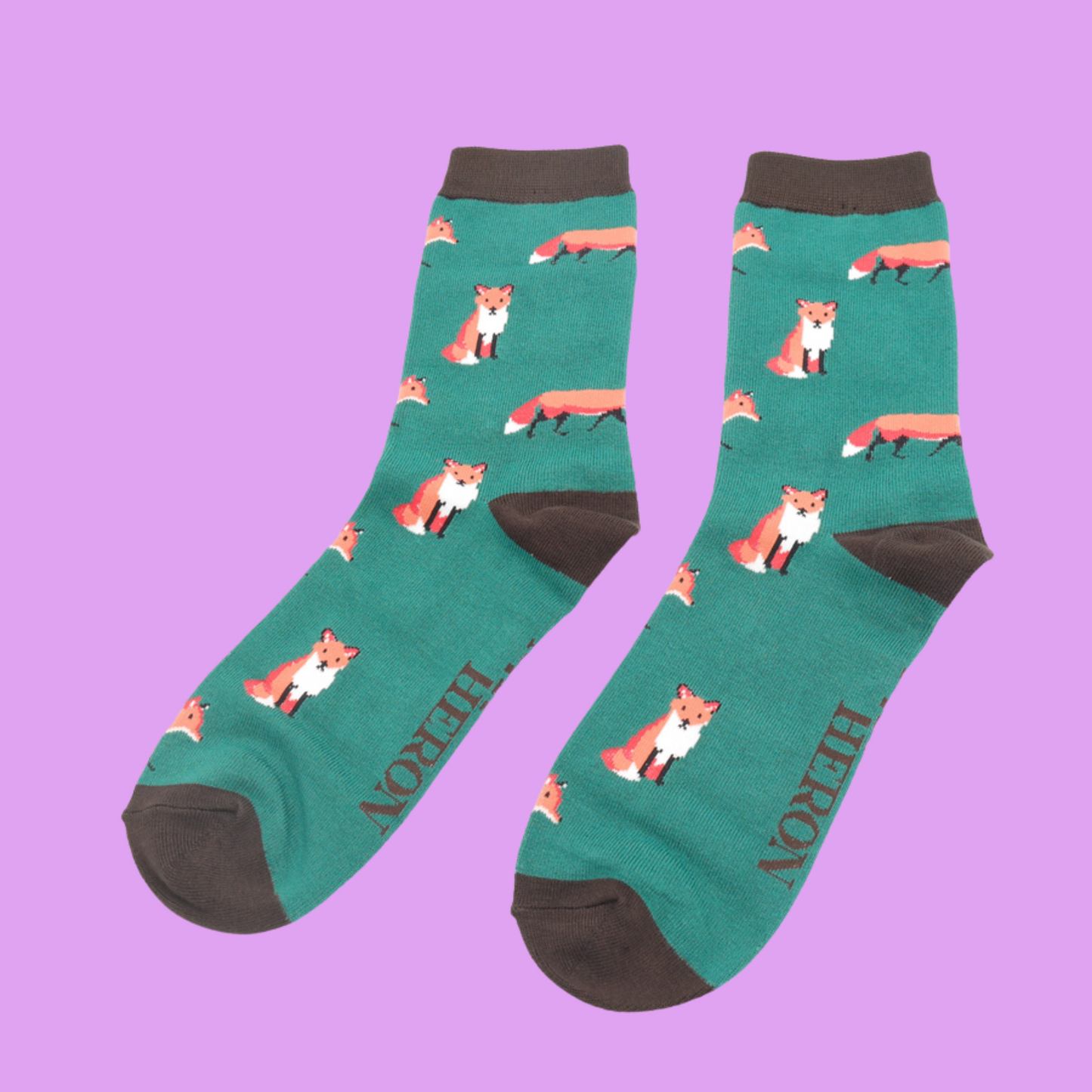 
                  
                    A pair of socks featuring a cute fox design. Green legs, grey cuff, heel and toe.
                  
                