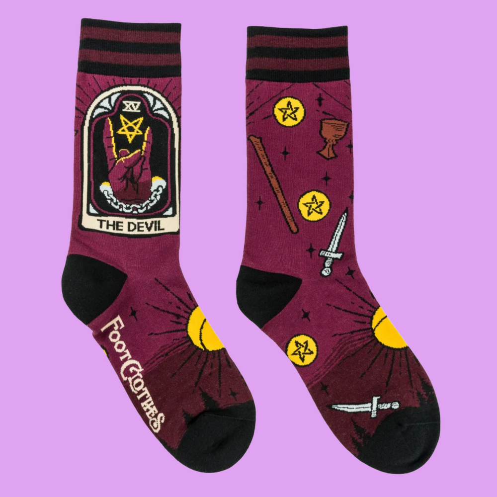 
                      
                        A pair of socks featuring the Devil tarot card. Deep red legs, black heel, toe and cuff. 
                      
                    