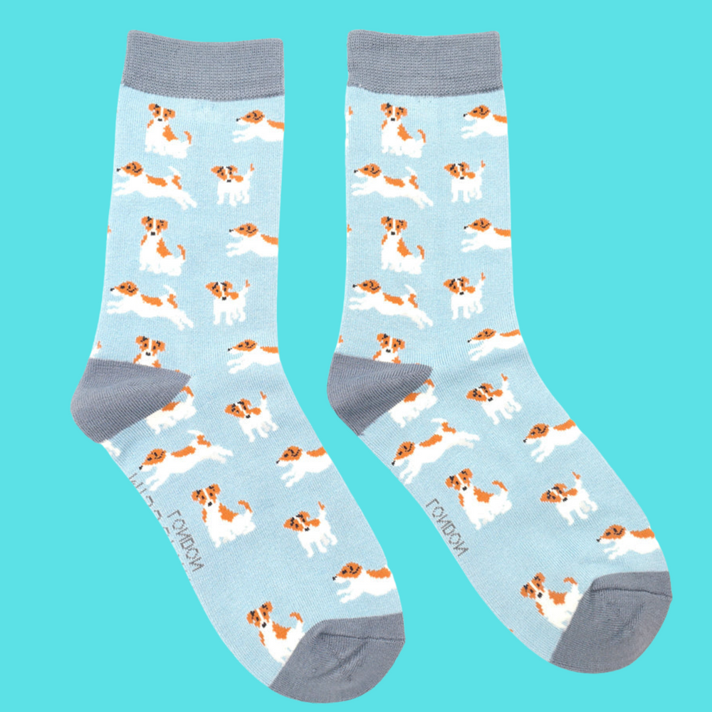 
                      
                        A pair of socks featuring a jack russell motif. Light blue legs, grey heel, toe and cuff. 
                      
                    