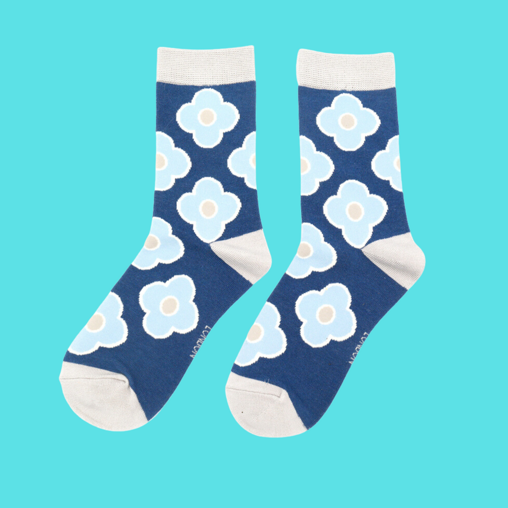 
                      
                        A pair of socks depicting a retro flower pattern. Blue legs, cream heel, toe and cuff.
                      
                    